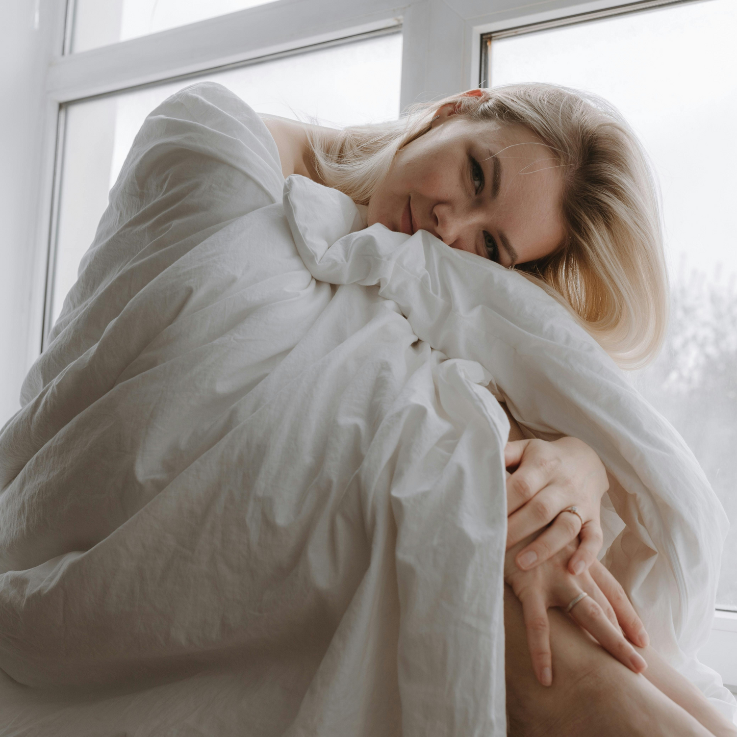 A girl wrapped in a nAtural Bamboo Duvet 